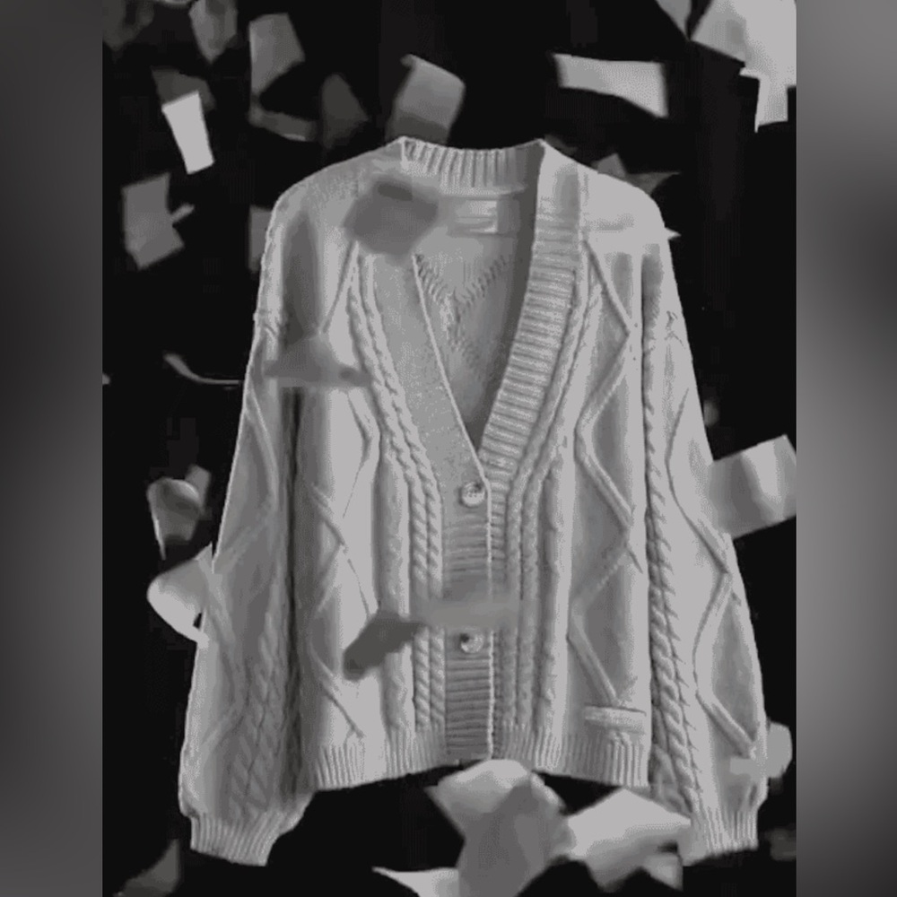 tTPD Cardigan. It is still in original shipping plastic packaging.
